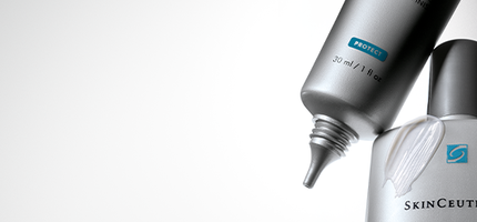 A close-up of two SkinCeuticals sunscreen tubes, one labeled "Physical Matte UV Defense" and the other "Delicate Skin UV Defense," both showcasing their products with SPF protection.