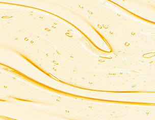 Texture fluide et brillante d&aposun liquide jaune clair, avec des reflets et des bulles d&aposair a la surface.