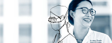 A smiling female doctor wearing glasses and a lab coat, with an artistic outline drawing of her profile beside her, set against a blurred hospital background.