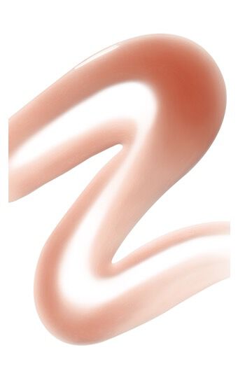Een golvende lijn van zachte, glanzende teintcreme in een lichtroze kleur.